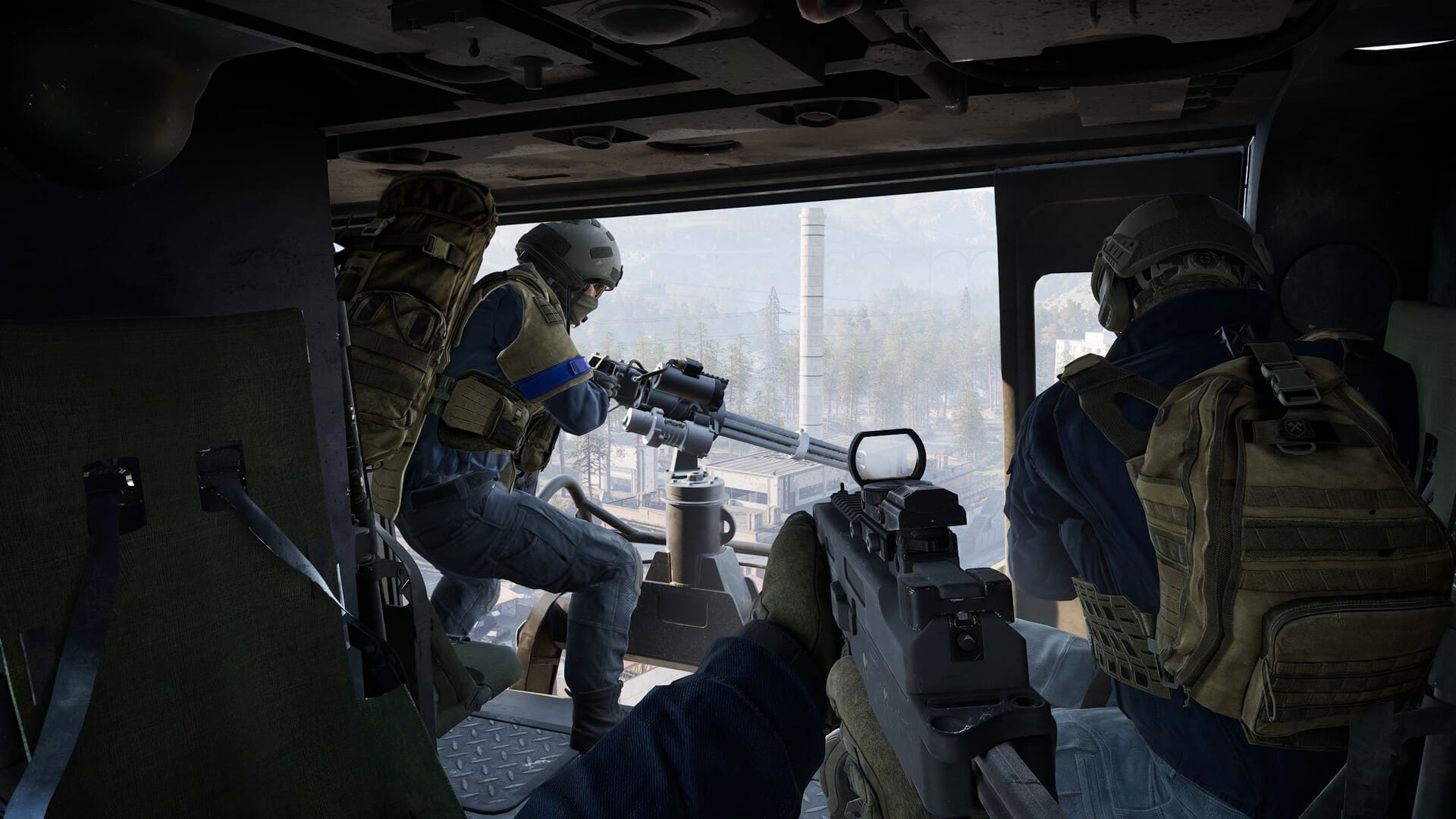 A door gunner lays down covering fire from a transport helicopter
